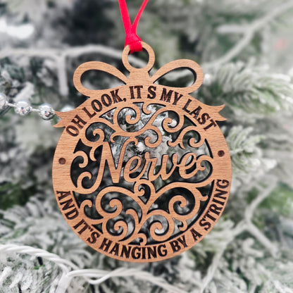Hanging By A String Christmas Ornament