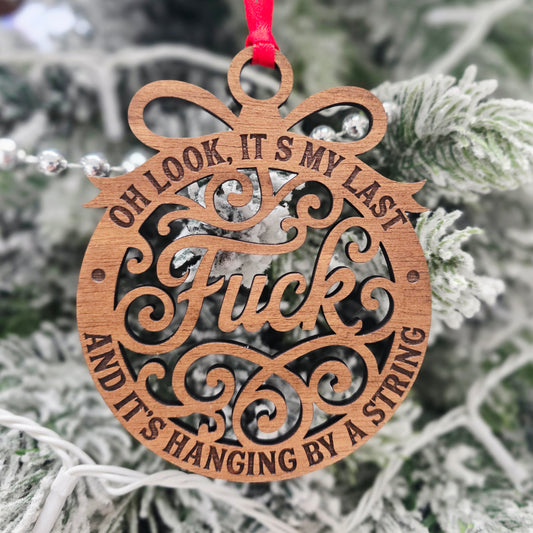 Hanging By A String Christmas Ornament