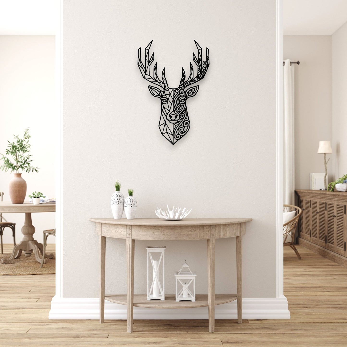 Decorative black deer head wall art in a living room setting.